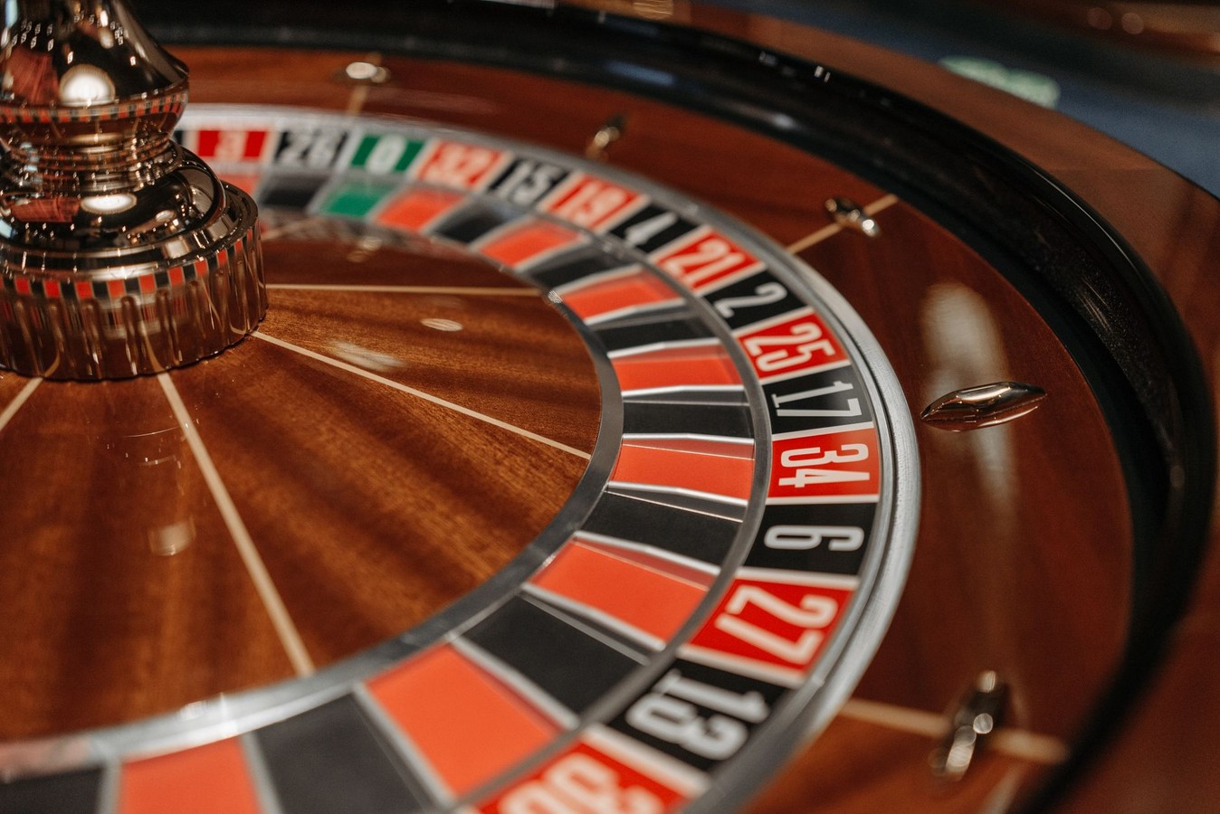 Roulette wheel and gaming lounge seating area